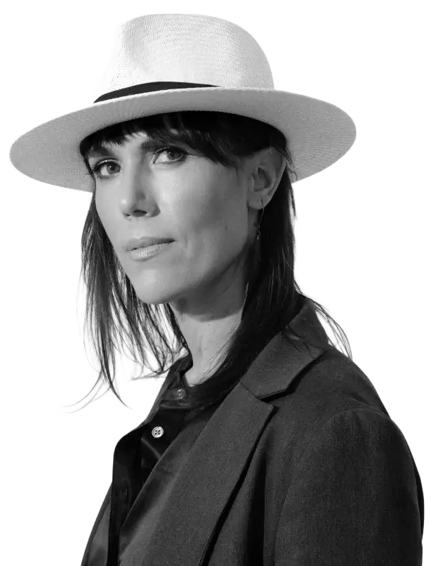 Shauna Griffiths wearing a white hat in a professional portrait for the About Shauna biography section.